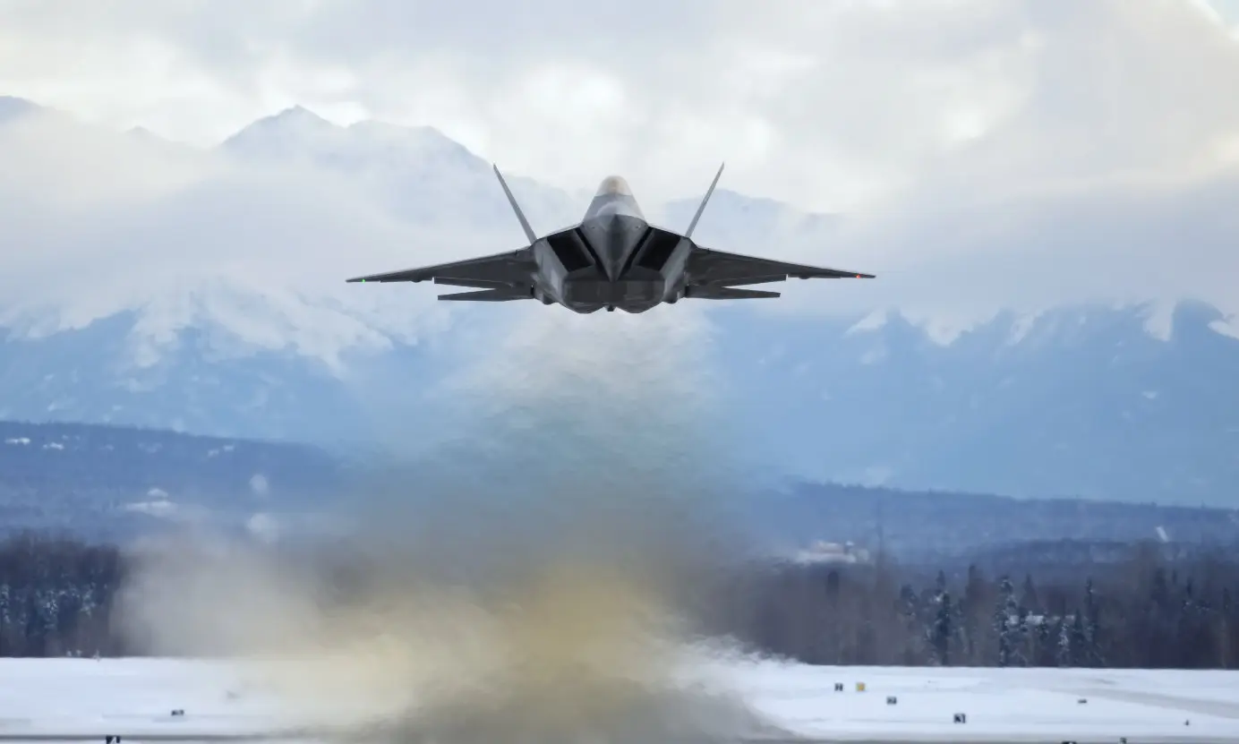 An F-22 Raptor flying close to ground